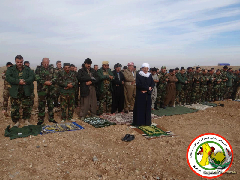 Peshmerga soldiers during praying