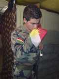 Syrian young kissing kurdistan flag