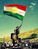 Kurdistan Flag held by a kurd