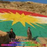 Kurdistan flag painted on mountain