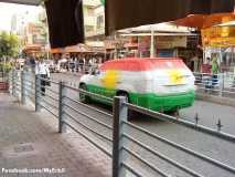 kurdistan flag painted on a car