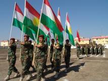 Peshmerga march with Kurdistan Flags
