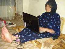 Kurdish grandmother using laptop